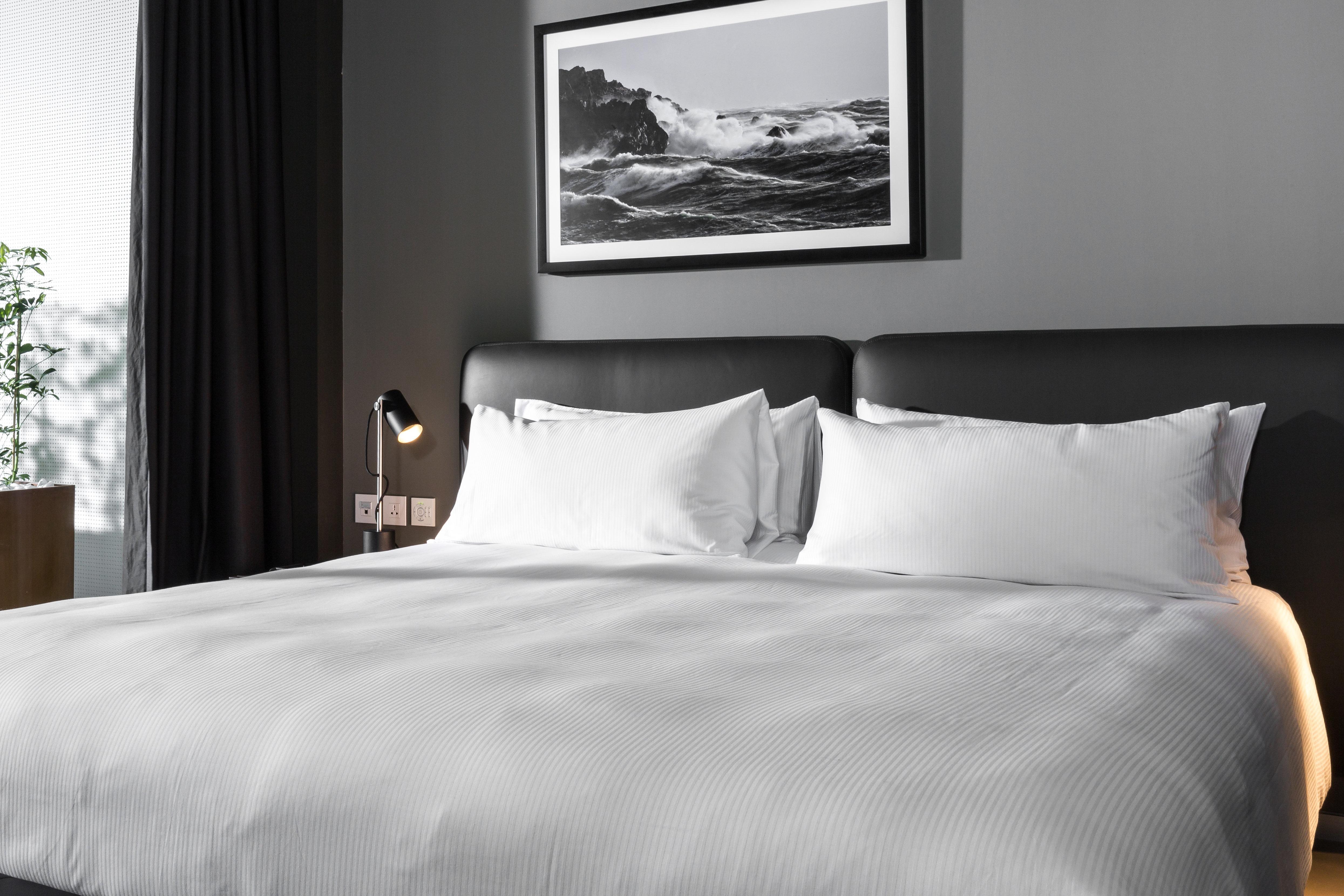 Intercontinental Malta By Ihg Hotel Saint Julian's Exterior photo A bed with two pillows